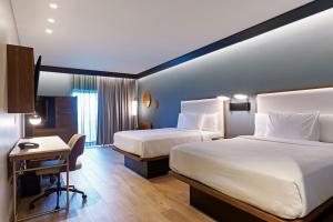 Letto o letti in una camera di Courtyard by Marriott Paramaribo