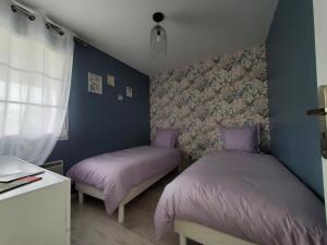 Posteľ alebo postele v izbe v ubytovaní Hortensia, Gîte famille et amis