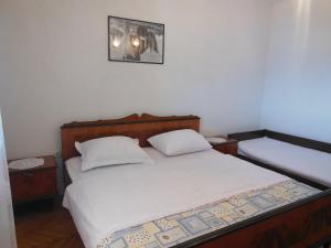 Posteľ alebo postele v izbe v ubytovaní Petar Apartments