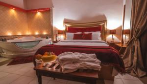 A bed or beds in a room at Asteras Hotel