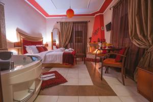 A bed or beds in a room at Asteras Hotel