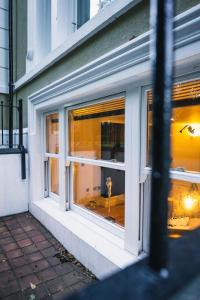 a window of a building with a reflection in it at Northumberland Lodge in Leamington Spa