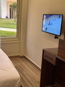 TV a/nebo společenská místnost v ubytování Giza Palace Pyramids View