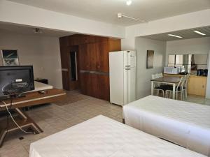 A cozinha ou cozinha compacta de Flat Garvey Apart-hotel