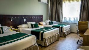 Posteľ alebo postele v izbe v ubytovaní Ecohotel Talca