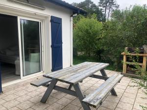 a wooden picnic table sitting on a patio at Lau Anaiak in Bidart