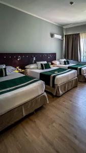 Posteľ alebo postele v izbe v ubytovaní Ecohotel Talca