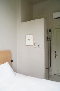 Postel nebo postele na pokoji v ubytování Hotel âme