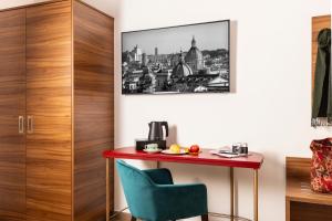 Příslušenství pro přípravu čaje a kávy v ubytování Adoro Hotel