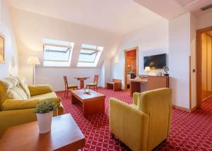 TV a/nebo společenská místnost v ubytování Hotel Zentral León