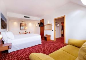 Postel nebo postele na pokoji v ubytování Hotel Zentral León