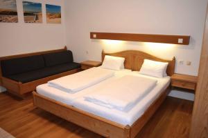 Postel nebo postele na pokoji v ubytování Hotel Andreas Hofer