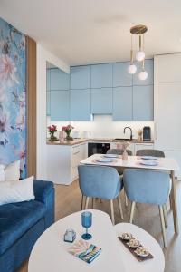 Η κουζίνα ή μικρή κουζίνα στο Boszkowo Horizon Park Apartament 37 "Mildgarden"