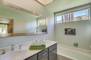 a bathroom with a sink and a mirror at Condo with Community Pools and Patios in Palm Springs! in Palm Springs +20 photos