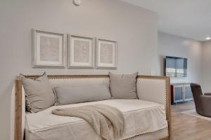 a couch with a blanket on it in a living room at Main Street Retreat Chatt in Chattanooga