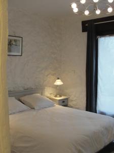 מיטה או מיטות בחדר ב-Le Mas De La Chérine