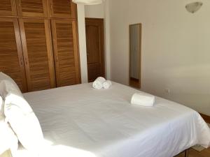 Postel nebo postele na pokoji v ubytování FreeSurfCamp & Hostel
