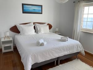 Postel nebo postele na pokoji v ubytování FreeSurfCamp & Hostel