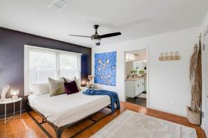 a bedroom with a bed with a blue accent wall at 8b 4b nearby pool Blanco wine trail town sq in Blanco