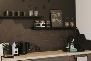 a kitchen with a counter top with a sink at Light house in Cēsis