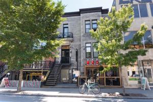 a building with a bike parked in front of it at #8 - Refined Studio - Self Check in - Plateau - St-Denis - AC - TV in Montréal