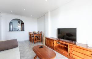 a living room with a couch and a television at Gorgeous Apartment In Santa Pola in Santa Pola