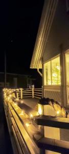 a house with lights on a porch at night at Villa in Kalajoki
