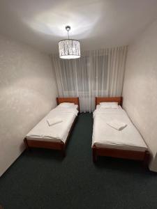 Ліжко або ліжка в номері Leśna Polana