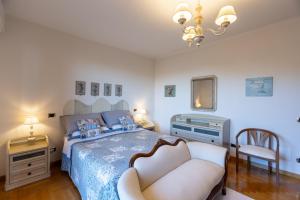 Ένα ή περισσότερα κρεβάτια σε δωμάτιο στο Casa Angolo delle Rose