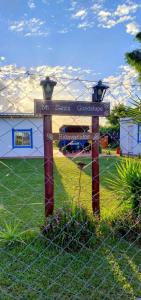 a sign for a park with a fence and a field at Mí Santa Guadalupe Esquina ctes in Esquina