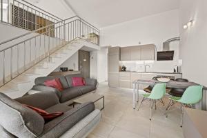 a living room with a couch and a table at Apartments Jana & Paula in Cres