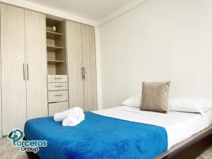 Postel nebo postele na pokoji v ubytování Apartamentos Amoblados En La Circunvalar Cerca a Parque Arboleda y Parque La Rebeca, Por Parceros Group