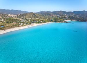 an aerial view of a beach and the ocean at Residence Le Bouganville in Villasimius