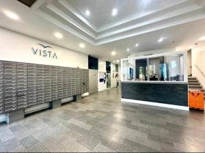 a lobby with a visseria sign on the wall at Modern 1BR Woolwich Flat Elizabeth Line 5 Min in Woolwich