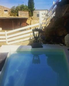 a view of a swimming pool in a backyard at Cal Hidalgo in Palouet