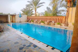 Bazén v ubytování Tebtunis Hotel nebo v jeho okolí