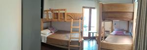 Ένα ή περισσότερα κρεβάτια σε δωμάτιο στο Temazcal Hostel