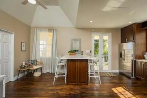 a kitchen with a sink and a counter top at The Moko Jumbie House - Premier Suite in Christiansted