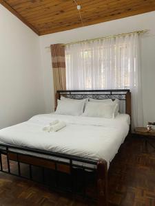 Postel nebo postele na pokoji v ubytování Bonsai Villa
