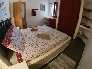a small bedroom with a bed with a box on it at sweet home B4 in Sal Rei