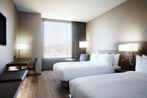 Postel nebo postele na pokoji v ubytování AC Hotel Tucson Downtown + 21 fotografií