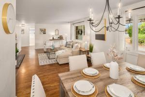 a dining room and living room with a table and chairs at DT Bellevue Hidden Gem With a View & AC in Bellevue