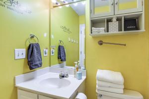 a bathroom with a sink and a mirror at 18 Mi to Nashville Home with Dedicated Workspace in Old Hickory +19 photos