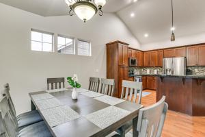 a kitchen and dining room with a table and chairs at Eugene Area Home 18 Mi to U of O! in Junction City +17 photos