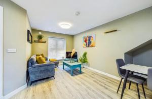 a living room with a couch and a table at Modern Luxury Living in Waterford City Center in Waterford