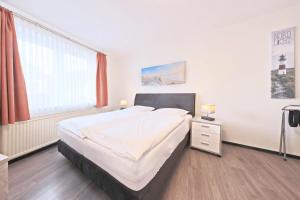 Postel nebo postele na pokoji v ubytování Hotel Hülsmann Garni