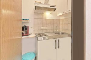 Kuchyň nebo kuchyňský kout v ubytování Hotel Hülsmann Garni