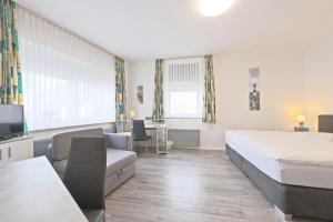 Postel nebo postele na pokoji v ubytování Hotel Hülsmann Garni