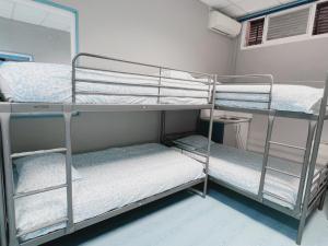 Łóżko lub łóżka w pokoju w obiekcie Hostel Las Rosas