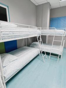 Łóżko lub łóżka w pokoju w obiekcie Hostel Las Rosas